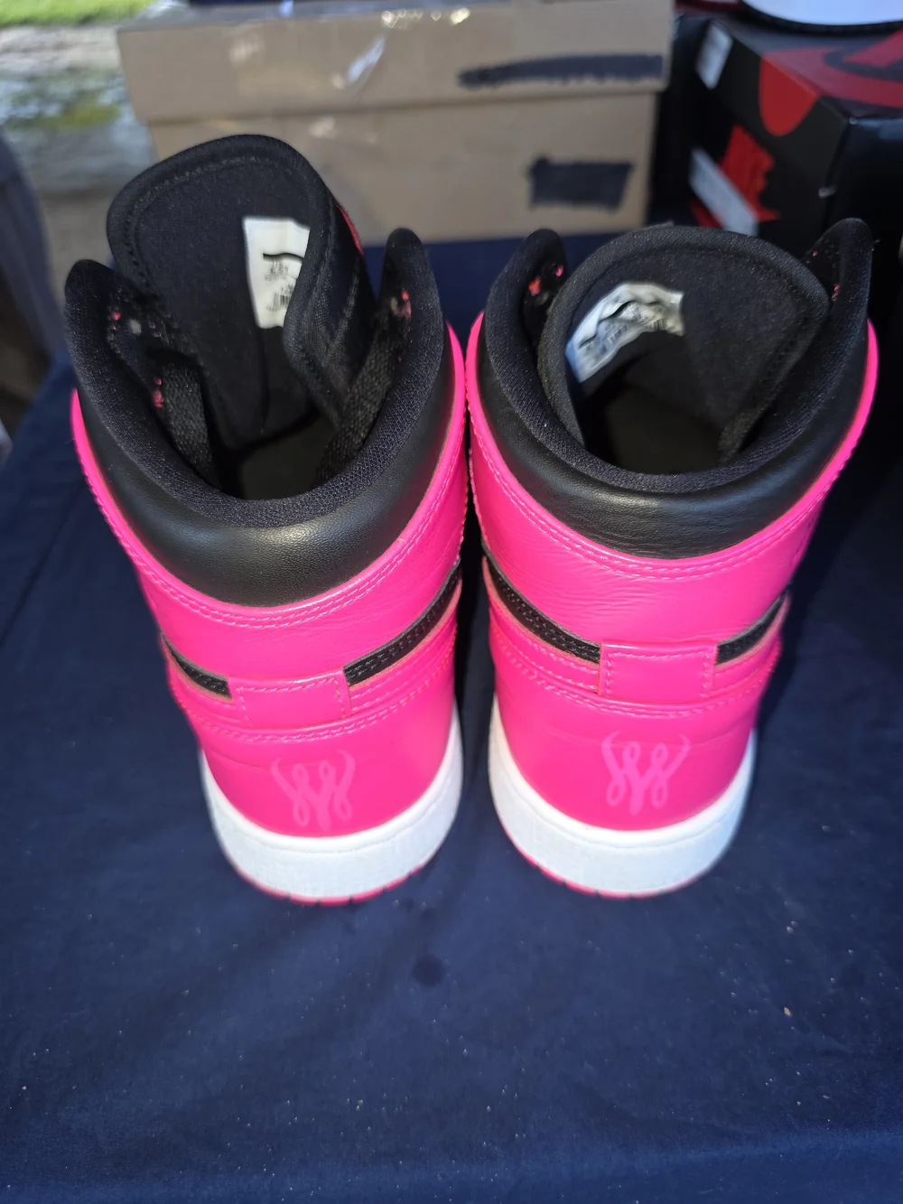 Jordan Women’s High-Top Sneakers in Black and Bright Pink